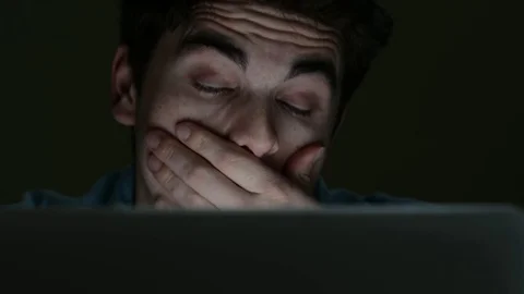Tired Young Man Working On Laptop Late At Night Stock Footage 75783249