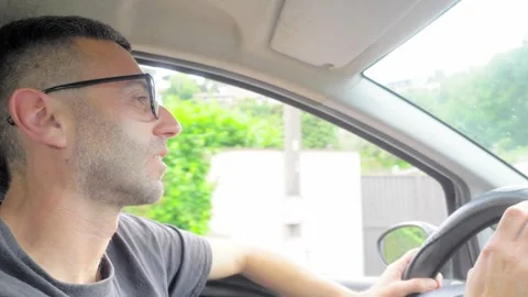 Tired Young Man Yawning While Driving, Dangerous Drowsy Driving Risk Stock Footage 335701754