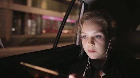 Tired Young Woman Using a Tablet Computer in the Car Stock Footage 81015208