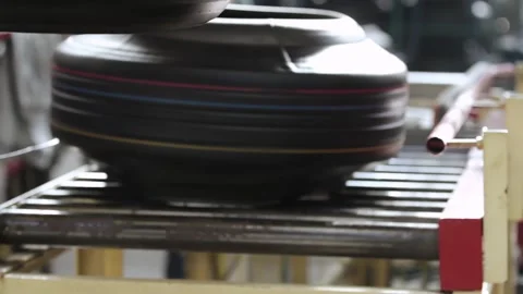 Tires on the conveyor in the tire pressing shop. Stock Footage