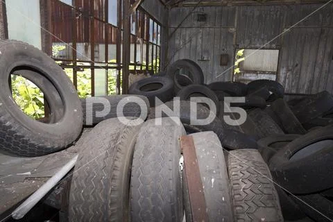 Tires in old workroom Stock Photos