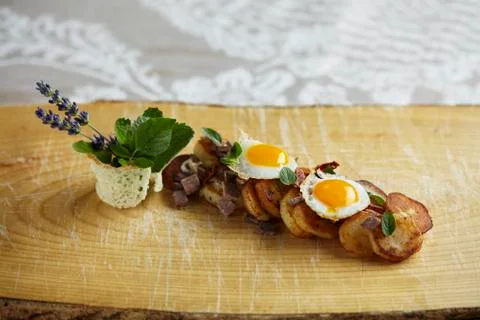 Tiroler (typical Tirolean dish using leftovers) with quail's eggs and fresh Stock Photos