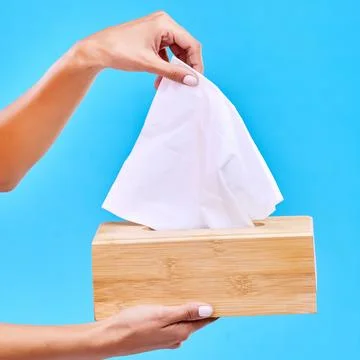 Tissue, blue background and hands with box for handkerchief for flu, sickness Stock Photos
