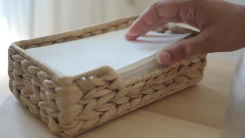 Tissue box on a wooden table in a bright room Stock Footage 340494357