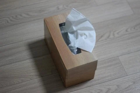 Tissue box on wooden table Stock Photos