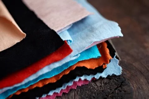 Tissue colored materials, on wood background. closeup shot. Stock Photos