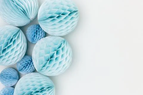Tissue paper balls different sizes on a blue background. Stock Photos