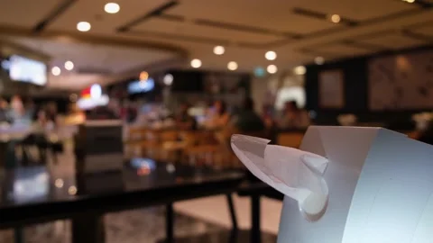 Tissue Paper Holder on a table and other tables with customers at the Stock Footage 256147220