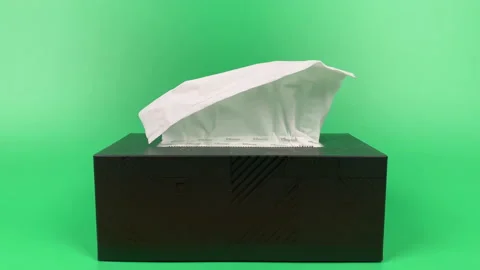 Tissue paper in tissue paper box isolated on green background. Stock Footage 201349178