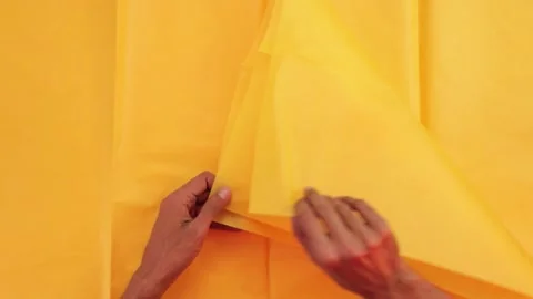 Tissue paper yellow sheets Stock Footage 170514395