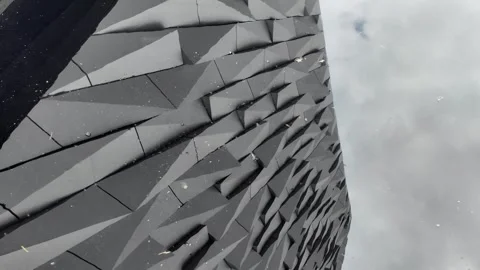 Titanic Belfast - Architectural Reflection in the Titanic Quarter Water Stock Footage 338222342