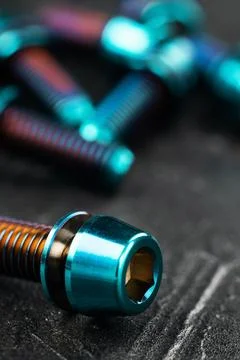 Titanium bicycle bots on a black textured background Foto stock