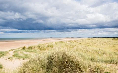 Titchwell beach under a dramatic sky Stock Photos