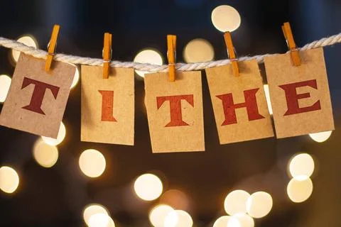  Tithe Concept Clipped Cards and Lights The word TITHE printed on clothesp... Stock Photos