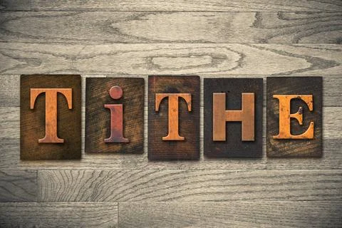 Tithe Concept Wooden Letterpress Type The word TITHE written in wooden let... Stock Photos