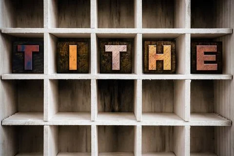  Tithe Concept Wooden Letterpress Type in Drawer The word TITHE written in... Stock Photos