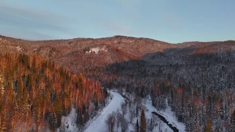 Title (79 chars): 4K Winter Sunset Flight Over Sheregesh Valley at Ski Resort Stock Footage 330517708
