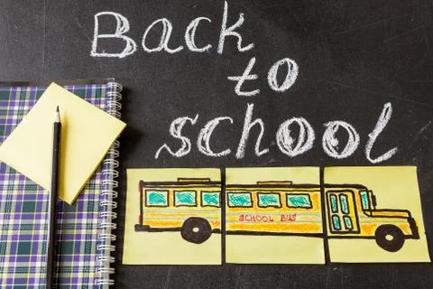 The title "Back to school"  written by white chalk on the black chalkboard, th Stock Photos