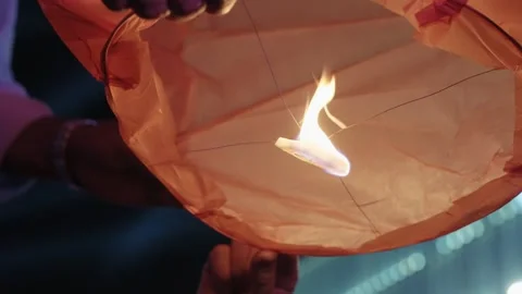 Title: Hands Lighting Sky Lantern Flame At São João Festival Porto Stock Footage 340595207