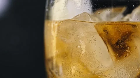 Title: Lemonade with Ice Cubes and Bubbles Stock Footage 314834669