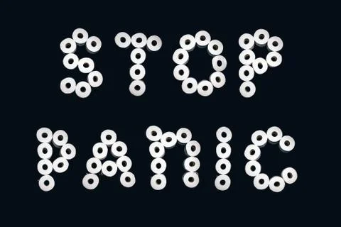Title Stop panic made with rolls of toilet paper on black background. Stock Photos