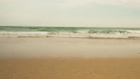 Title: Sunny Beach and Ocean Waves with Surfers in Portugal Stock-Footage 336729901
