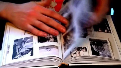 Title Young man flips pages in his book Stock Footage 84950155