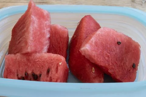 TITLE:.Sliced watermelon in plastic container Stock Photos