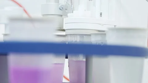 TITRATOR Machine working Laboratory Close up in beaker pink liquid 50fps Video stock 247494444