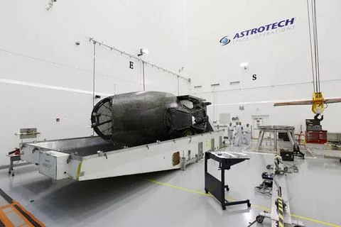 TITUSVILLE, Fla. - Technicians inspect the Tracking and Data Relay Satelli... Stock Photos