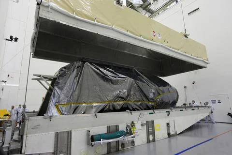 TITUSVILLE, Fla. - Technicians unpack the Tracking and Data Relay Satellit... Stock Photos