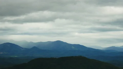 T/L Beautiful clouds moving over the mountain Stock Footage 162602571