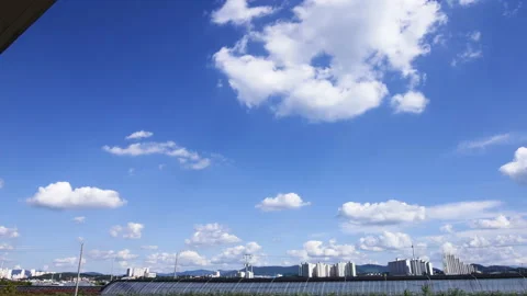 T/L Beautiful white clouds over the countryside plant Stock Footage 162564112