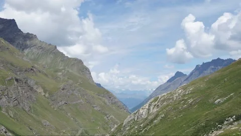 TL Clouds on a mountain valley Stock Footage