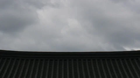 T/L Clouds move over the traditional korean architecture roof tile Stock Footage 164013543
