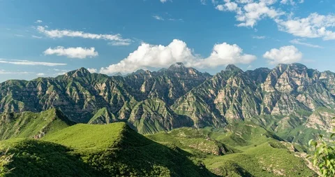 T/L Clouds OVer Mountains Stock Footage 103507264