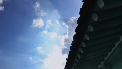 T/L ED Clouds flowing over the eaves of traditional Korean hanok archite Stock Footage 164009292