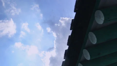 T/L ED Clouds flowing over the eaves of traditional Korean hanok archite Stock Footage 164009455
