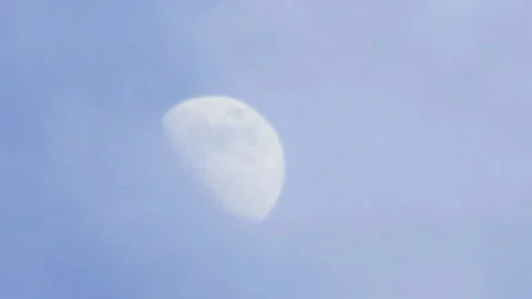 T/L HD Daytime Moon with passing clouds slowly in tiemalapse shot Stock Footage 162597344