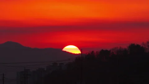 T/L HD Sunset over the mountain in village Stock Footage 162597379