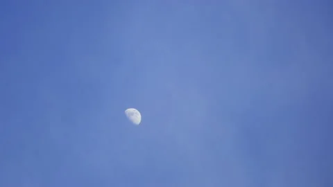 T/L Moon In Daytime With White Soft Clouds passing Stock Footage 162597315