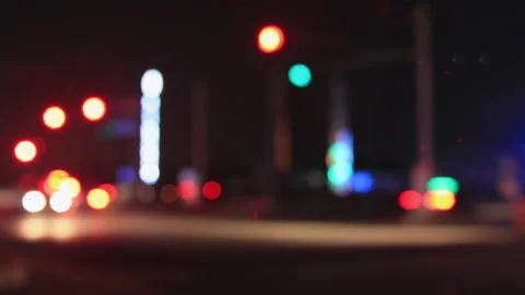 T/L Start Moving bokeh circles of traffic in front of signal light Stock Footage 162594887