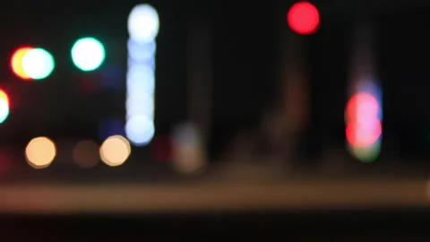 T/L Start Moving bokeh circles of traffic in front of signal light Stock Footage 162595069