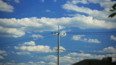 T/L Telegraph pole with clouds moving in timelapse scene Stock Footage 162597840