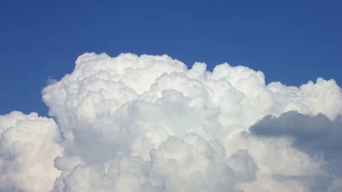 T/L Thick mass of white, fluffy, bubbling cumulous storm clouds Stock Footage 162589110