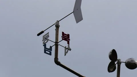 T/L Weather vane in moving cloud background Stock Footage 162599712