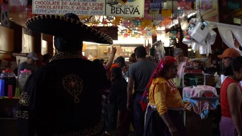 Tlacolula, Oaxaca, Mexico March 2020: Mexican singer performs at busy market in Stock Footage