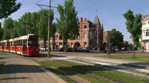 TM Tram of The Hague tramway network stops in The Hague's Staten Quarter Stock Footage 24802033