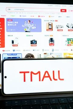 Tmall and taobao e commerce platforms with smartphone displaying logo Stock Photos