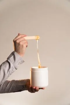 Tmaster stretches sugar paste vertically with spatula wooden Stock Photos